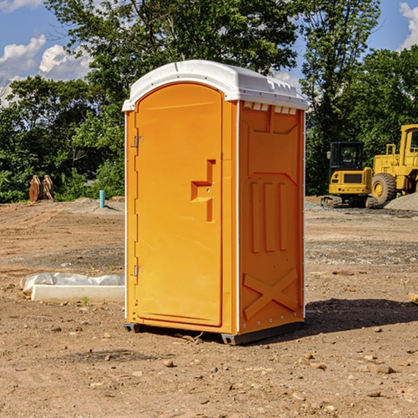 what is the cost difference between standard and deluxe portable restroom rentals in Mayville